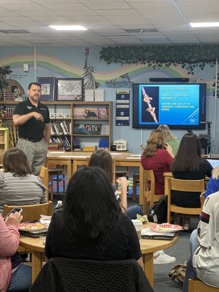 Dr Aldrich teaching at an event